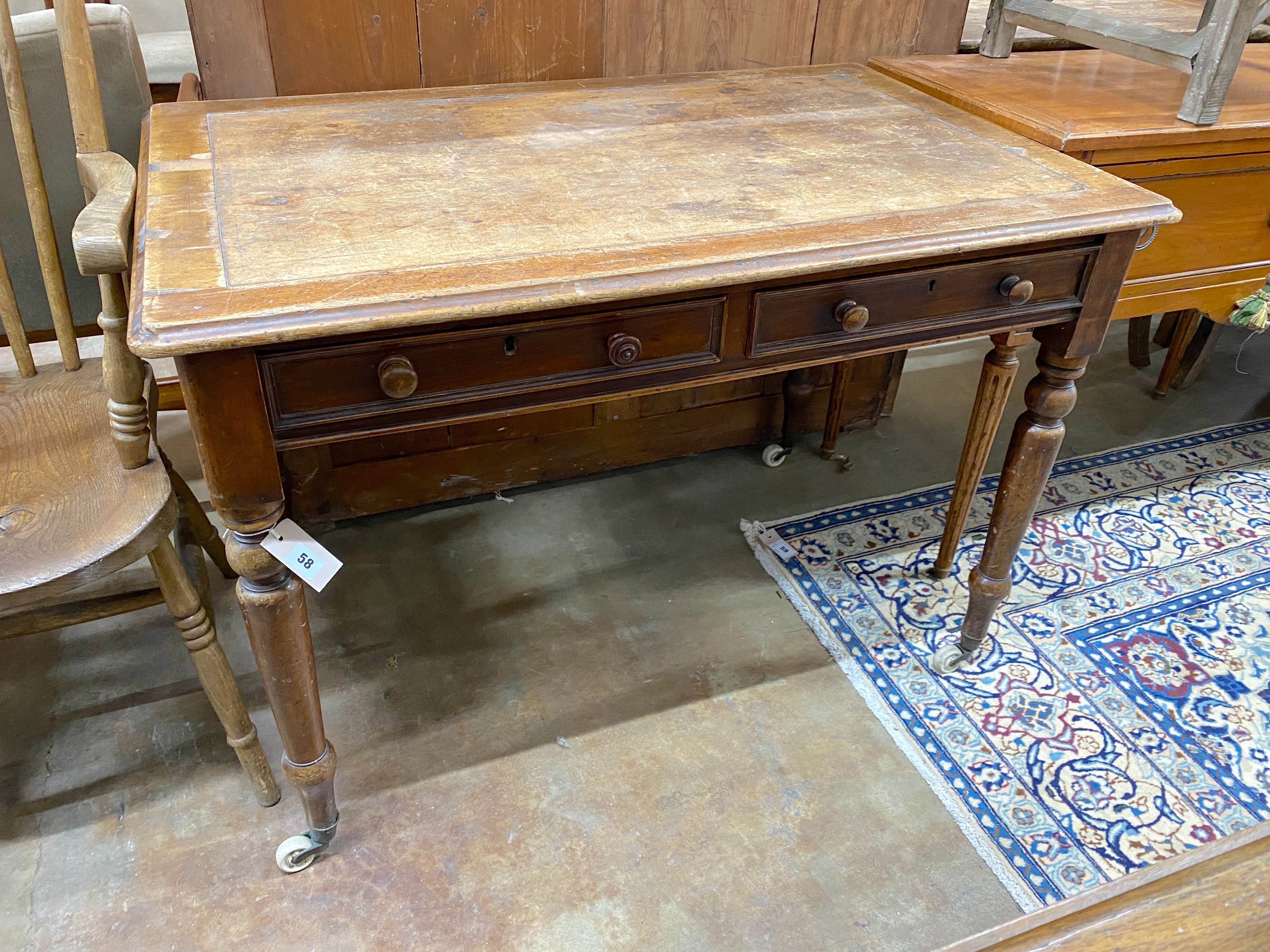 A Victorian mahogany two drawer writing table, width 106cm, depth 68cm, height 73cm